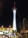 1989 Nissan 300ZX - The Stratosphere Tower dominates the Las Vegas skyline at night, with traffic flowing on the Strip below.
