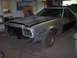 1975 Ford Ranchero - This 1975 Ford Ranchero is undergoing bodywork, showing its primer finish and missing headlights.