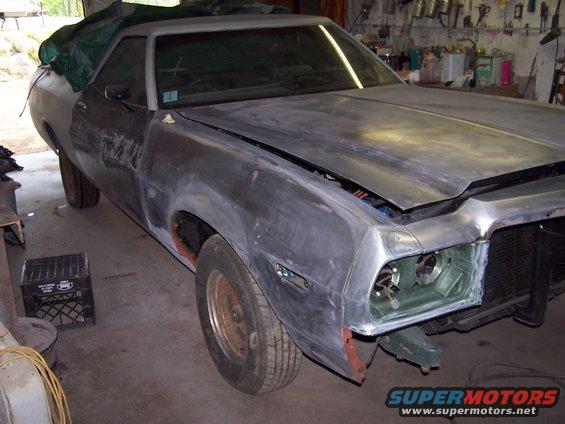 1975 Ford Ranchero in primer, front 3/4 view, undergoing restoration
