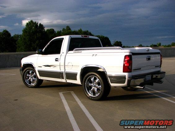 White 2002 Chevrolet Silverado 1500 pickup truck parked in a lot, rear 3/4 view