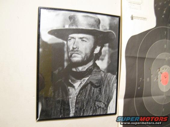 Clint Eastwood portrait with a cigar in his mouth, wearing a cowboy hat