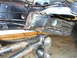 1994 Ford F-250 - Close-up of the undercarriage reveals the fuel filter and suspension linkage, with visible welding on the frame.