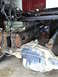 1994 Ford F-250 - Close-up view of the rear axle and suspension system of a truck, with exposed wiring.