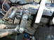 1994 Ford F-250 - Custom welded suspension components are visible on the underside of a vehicle.
