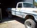 1971 Ford F-100 - This 1971 Ford F-100 pickup truck is parked inside a garage, showing its weathered exterior and off-road tires.