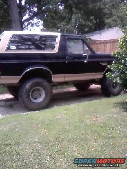 1990 Ford Bronco, lifted with large tires, side view
