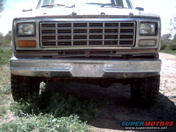 Front view of a 1980-1986 Ford F-Series truck. It has a chrome bumper and a large grille