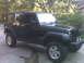 2008 Jeep Wrangler - This black Jeep Wrangler is modified with an aftermarket bumper and auxiliary lights.