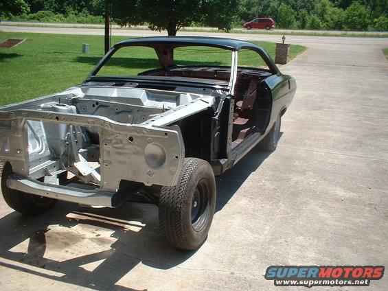 1967 Mercury Cyclone body stripped down, viewed from the front three-quarter angle, showing exposed engine bay and interior