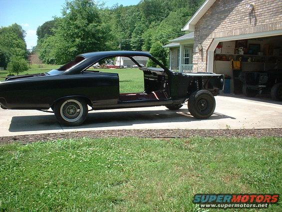 1967 Mercury Cyclone body, black, missing doors and front clip, parked on driveway