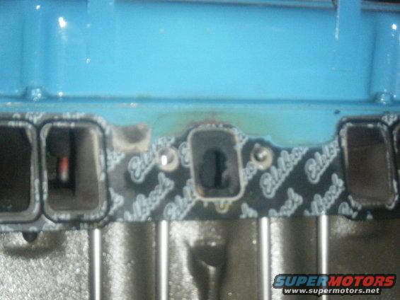 Close-up of an engine intake manifold gasket with 'Edelbrock' text visible