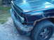1994 GMC Jimmy - Front corner of a 1994 GMC Jimmy shows rust damage on the fender.