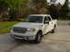 2007 Ford Mustang - This white pickup truck, likely a 2004 model, is shown from the front three-quarter angle on a paved surface.