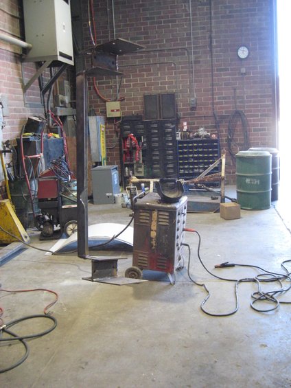 Welding equipment and workshop scene with brick walls and metal cabinets