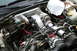2001 Subaru Legacy - Engine bay with a supercharger modification, hoses, and wiring visible.