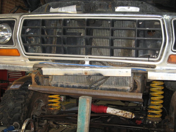 1978 Ford Bronco grille and front suspension with yellow coil springs and red-capped shock absorber