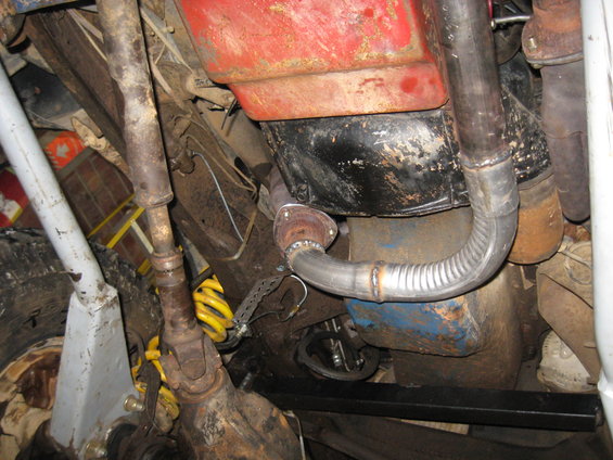 Undercarriage view of a vehicle's exhaust system and suspension