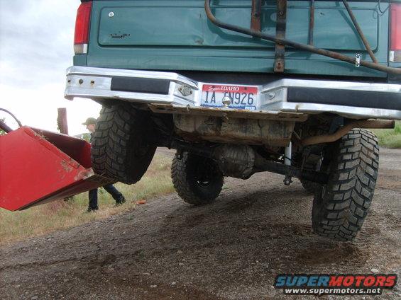 Green 1989 Ford Bronco rear view with red attachment and Idaho license plate