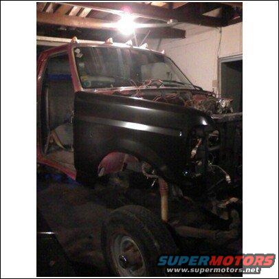 1994 Ford F-250 front fender and hood removed, showing engine bay and interior