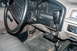 1995 Ford Bronco - The interior of a 1995 Ford Bronco shows a CB radio setup mounted to the dashboard.