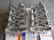 1995 Ford Taurus - Two engine cylinder heads are shown, resting on a box with a date stamp of 05.28.2009.
