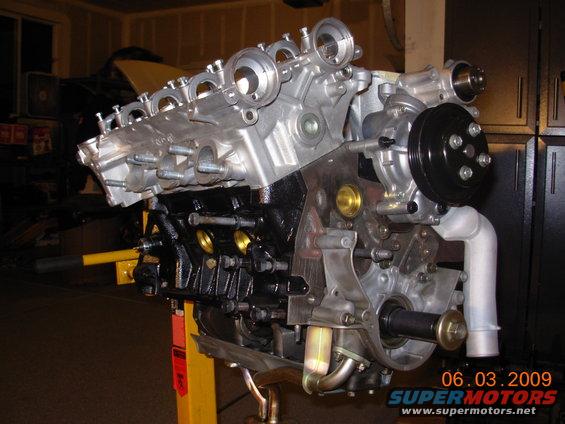 V6 engine on an engine stand, with a date stamp of 06.03.2009