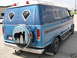 1978 Ford E150 - Rear view of a customized 1978 Ford E150 van a spare tire cover with a cowboy and horse graphic.