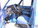 1978 Ford E150 - Interior view of a 1978 Ford E150 van, blue upholstery and dashboard details.