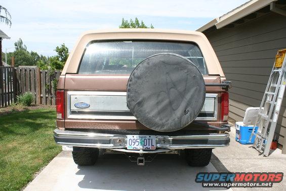 Brown Ford Bronco rear view with spare tire cover, chrome bumper, and Oregon license plate