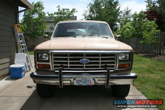 Tan Ford Bronco front view, chrome grille, Oregon license plate 095 DTL