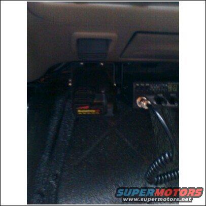 Interior view of a vehicle with a CB radio and a scanner mounted on the dash
