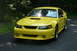 2002 Ford Mustang - Front 3/4 view of a yellow 2002 Ford Mustang.