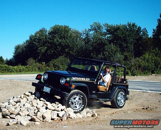 jeep.jpg my 97 tj  on some little rocks.
