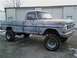 1971 Ford F-100 - This 1971 Ford F-100 pickup truck features a lifted suspension and a weathered blue paint job.