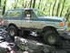 1991 Ford Bronco - This 1991 Ford Bronco navigates a rocky path through a wooded area.