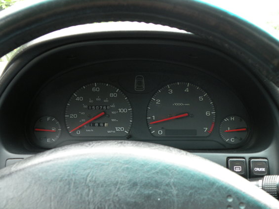 1998 Subaru Legacy interior dashboard with odometer reading 150768