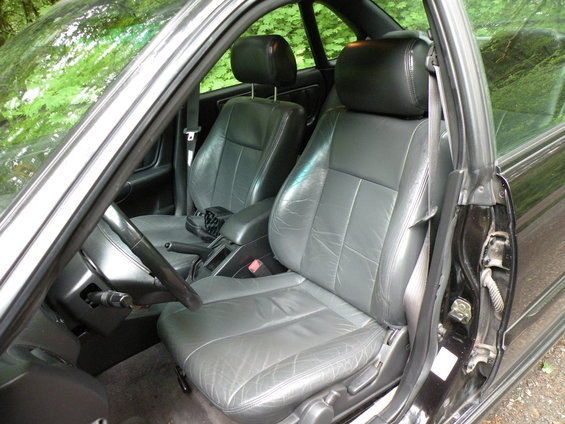 Interior view of gray leather seats and dashboard