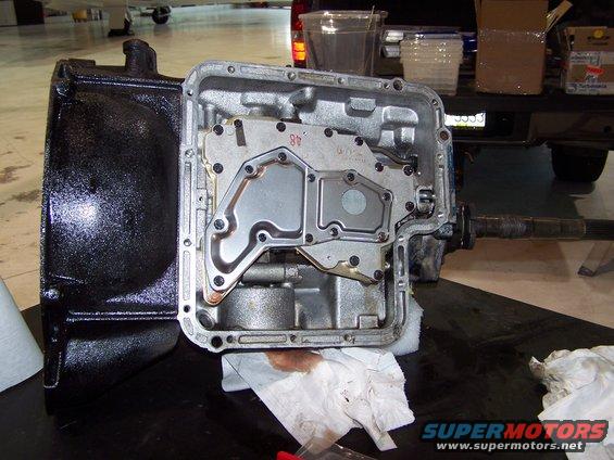 100_2713.jpg this is the valve body with the filter installed into the transmission.

I found a bunch of clutch material and dirt in the pan and valve body and servo when I did the shift kit, so I decided to overhaul the tranny before installing it into the car, just in case.