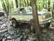 1991 Ford Bronco - A 1991 Ford Bronco navigates a challenging rocky trail during an off-road event.