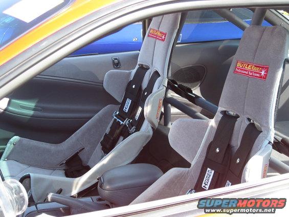 Interior shot of racing seats with Butlerbuilt and Hooker Harness branding