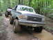 1991 Ford Bronco - This 1991 Ford Bronco navigates a muddy trail during an off-road event.