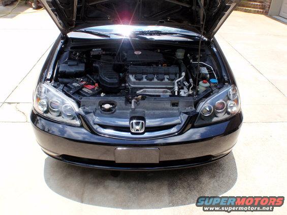Black Honda Civic engine bay with hood open