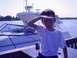 1979 Ford F-250 - A boy stands on a dock, looking out at boats on a sunny day.