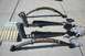1989 Ford Bronco - Various vehicle suspension components are laid out on a concrete surface.