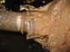 1991 Ford Bronco - A close-up view of a heavily mud-caked vehicle axle, showing signs of wear and tear.