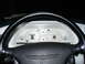 1995 Ford Thunderbird - The dashboard features white-faced gauges and a prominent steering wheel with an LX emblem.