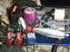 1996 Ford Bronco - Close-up of a toy RC car engine, showing its exhaust and air filter components.
