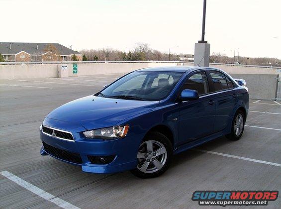 Blue 2009 Mitsubishi Lancer sedan parked in a lot
