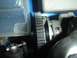 1996 Ford Bronco - A mechanical part with a toothed wheel and warning label is visible in this close-up.