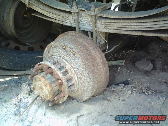 Rusted brake drum and hub assembly with leaf springs above